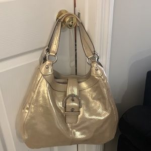 Medium Coach hobo. Only wear 1 time and got dirt on lower left side of bag.